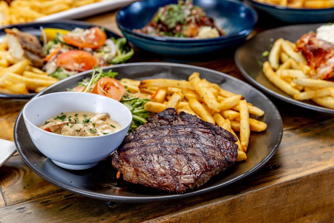 Featured image for “Steak with Garlic Prawn Topper: A Delicious Combination at Eagle Tavern”
